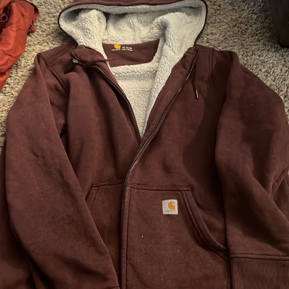 Woman’s burgundy sherpa lined Carhart hoodie